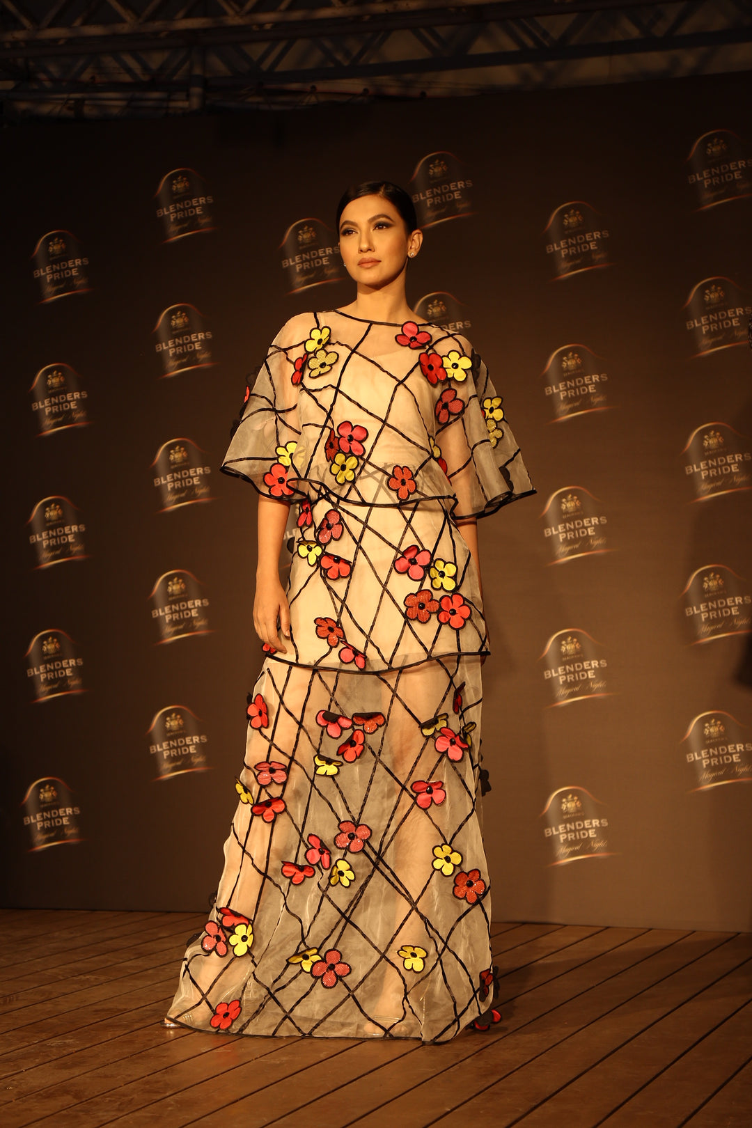 Gauhar Khan in our 3-D multi coloured floral two tiered gown on organz –  Salita Nanda